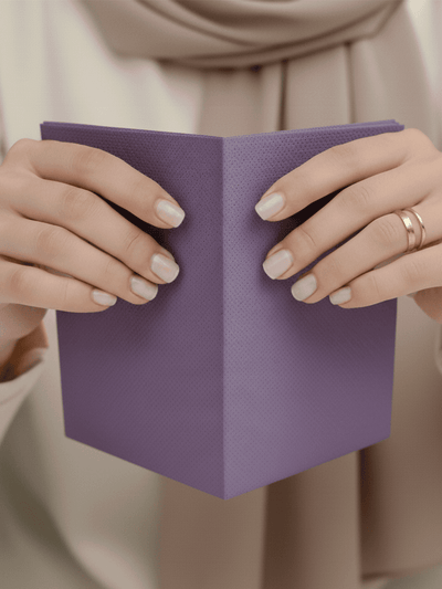 Unfold the toilet seat cover from the pouch.