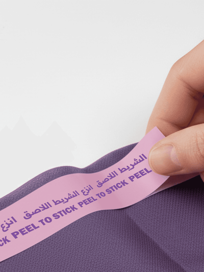 Peel off the adhesive strips to secure it in place on the seat.